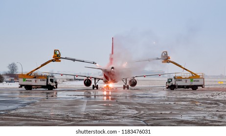 Schönefeld, Germany - January 31 2017: De-icing Of An Aircraft At Berlin Schönefeld Airport