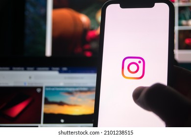 Germany - January 5,2022: Young Man Hand Holding Iphone With Logo Of Instagram Application. Instagram Is Largest And Most Popular Photograph Social Networking.