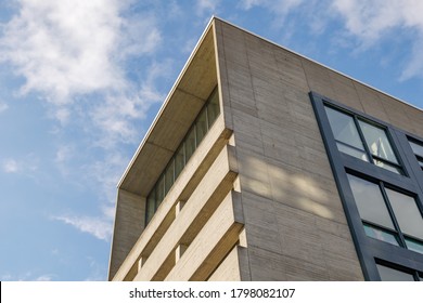 Düsseldorf, Germany - JULY 2020: Diminishing Perspective Low Angle View, Exterior Architectural Detail Of Brutalist Style Raw Rough Concrete Facade Of Modern Office Buildings. 