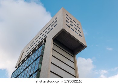 Düsseldorf, Germany - JULY 2020: Diminishing Perspective Low Angle View, Exterior Architectural Detail Of Brutalist Style Raw Rough Concrete Facade Of Modern Office Buildings. 