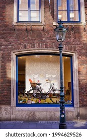 Düsseldorf, Germany - July 30, 2020: Vintage window display of "Gut und Gerne", a lovely small chocolate place in the popular Old Town area near Rhine River in Düsseldorf. 