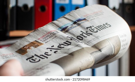 GERMANY - JUN 27, 2022: New York Times Magazine In Male Hands