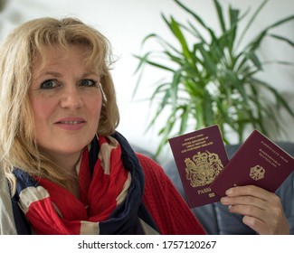 Osnabrück, Germany - June 14 2020: Person With Dual Citizenship Holding British And German Passports 