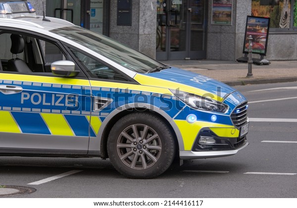 Germany June 2021: A German police car in action\
is parked in a square