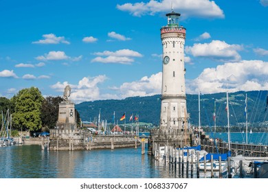 GERMANY, LINDAU - AUGUST 21: view of the lighthouse and a lion statue at the entrance to the port of Lindau at lake Constance, Bodensee on August 21, 2015