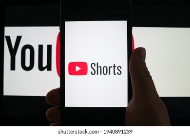 Germany - March 22,2021: Youtube Shorts App Logo Seen On The Silhouette Of The Smartphone In One Hand. The New Competitor Of Tik Tok.