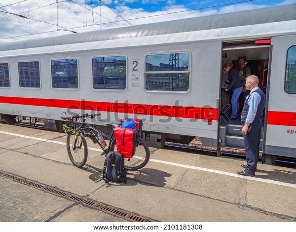 Germany - May 26, 2015:\
Traveling with a mountain bike loaded with heavy backpacks in\
German trains