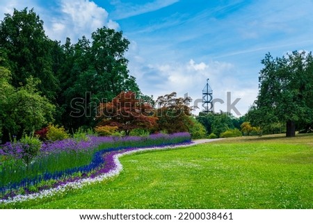 Germany, Stuttgart city district killesberg urban park colorful flowers and killesbergturm tower in beautiful nature landscape