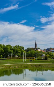 Germany, Stuttgart District Berg And Berger Church Behind City Railway And Reflecting Lake