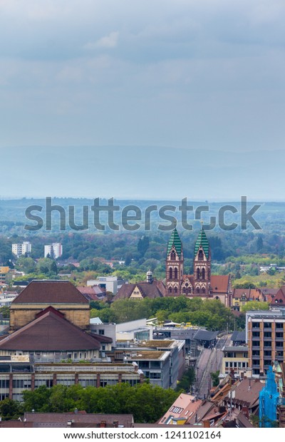Germany, Tram rails and Church of the sacred\
heart in Freiburg im\
Breisgau