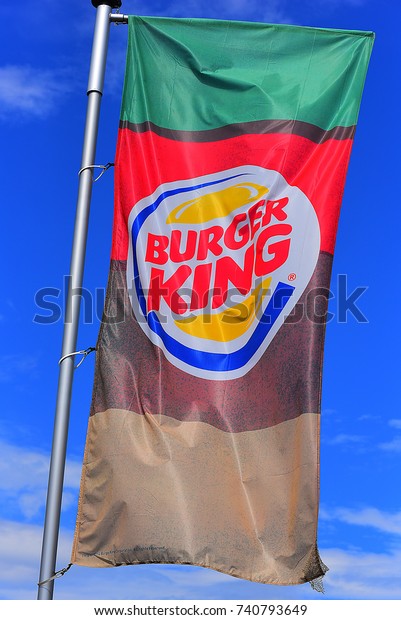 GERMANY-JULY 08:BURGER KING logo in the blue sky on July\
08, 2017 in Germany.\
