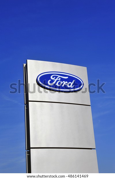 GERMANY-SEPT 15: FORD logo in the\
blue sky on September 15,2016 in ,Germany.The Ford Motor Company is\
an American multinational automaker. It was founded by Henry Ford.\
