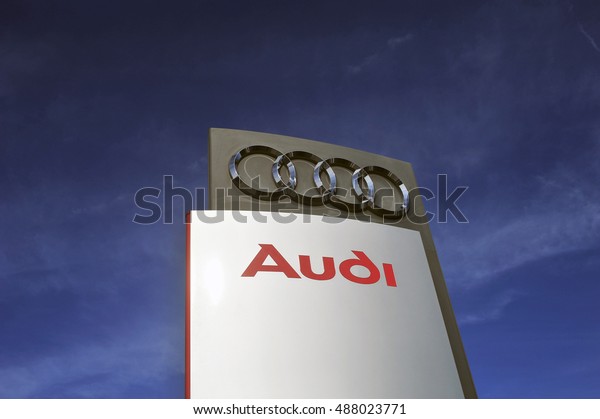 GERMANY-SEPT 22:AUDI logo in the blue sky on\
September 22,2016 in Germany.Audi is a German automobile\
manufacturer that designs, engineers, produces, markets and\
distributes luxury vehicles in\
Bavaria