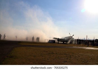 Germiston South Africa, August 20 2017. At The Rand Airshow. Mustang Sally In A Cloud Of Smoke Caused By A Car Burning Rubber Behind It.