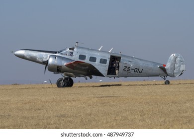 GERMISTON, SOUTH AFRICA-AUGUST 21 2016: A Beechcraft Model 18 Taxis Past With Parachutists At The Rand Airshow At Rand Airport.