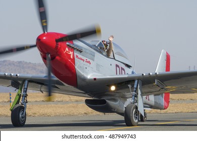 Germiston, SOUTH AFRICA-AUGUST 21 2016: Close Up To A Waving Menno Parsins Taxing Mustang Sally At The Rand Airshow At Rand Airport.