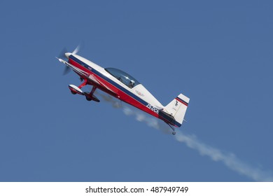 GERMISTON, SOUTH AFRICA-AUGUST 21 2016: Elton Bondi Climbs With Smoke In His Extra 300L At The Rand Airshow At Rand Airport.