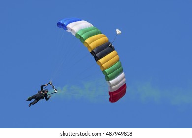 GERMISTON, SOUTH AFRICA-AUGUST 21 2016: A Parachutist Approaches With Smoke At The Rand Airshow At Rand Airport.