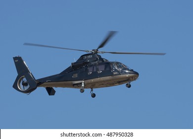 GERMISTON, SOUTH AFRICA-AUGUST 21 2016: A Dauphin Business Helicopter Flies Past With Wheels Extended At The Rand Airshow At Rand Airport.