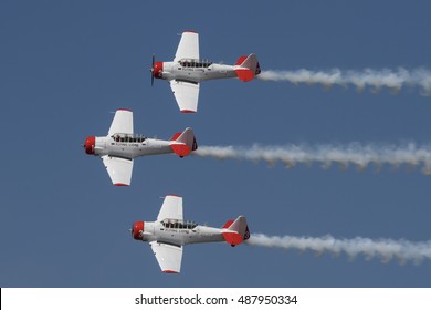 GERMISTON, SOUTH AFRICA-AUGUST 21 2016: The Flying Lions Aerobatic Team Fly In Formation With Smoke On At The Rand Airshow At Rand Airport.