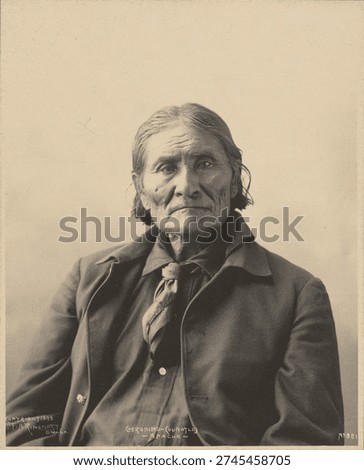 Geronimo (Guiyatle), Apache by Adolph F Muhr and Frank A Rinehart. Vintage black and white photography of a man.