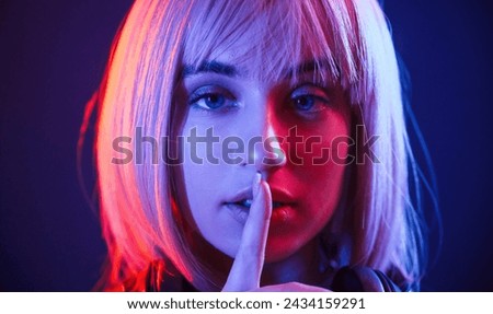 Similar – Young blonde woman asking for silence