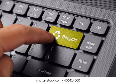 Gesture Of A Hand Finger Pushing The RECYCLE Button On Laptop