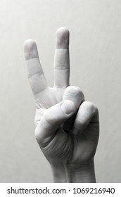 Gesture with two fingers up. Black and white image
