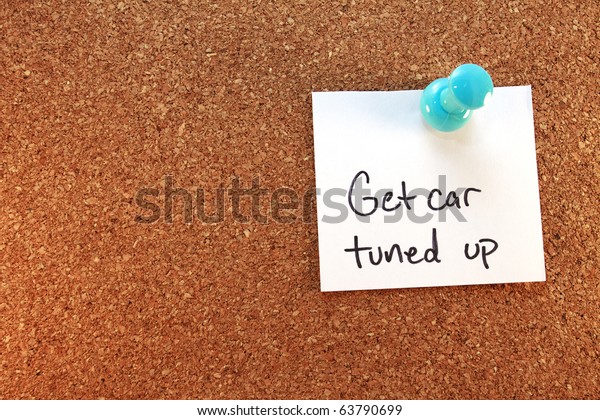 Get Car Tuned Up A get car tuned up note\
tacked on corkboard.\
Horizontal.
