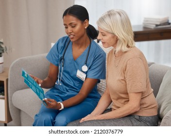 Get Informed, Make A Good Decision. Shot Of A Doctor Reading A Pamphlet About Covid-19 On The Sofa At Home.