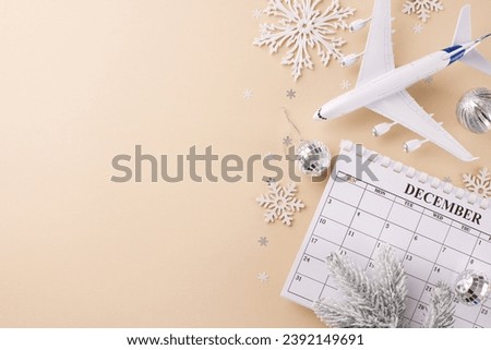 Get inspired for holiday Christmas travel. Top view photo of calendar, airplane model, tree ornaments, frost-kissed fir twigs, snowflakes on beige background with promo zone