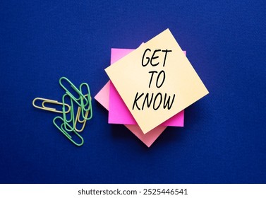 Get to Know symbol. Steaky Notes with words Get to Know. Beautiful deep blue background. Business and Get to Know concept. Copy space.