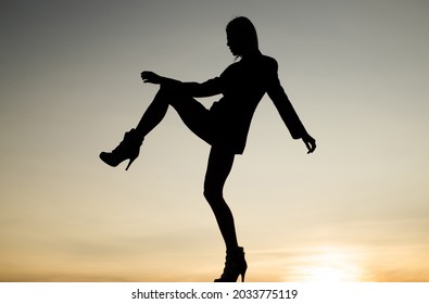 Get Up And Get Moving. Dance Girl. Girl Silhouette On Evening Sky. Female Performer