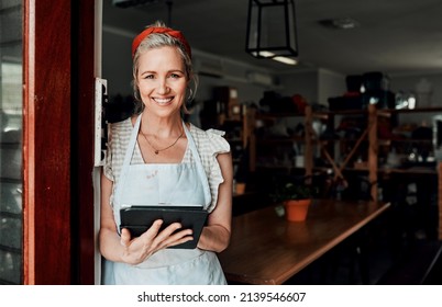 I get my inspiration from the internet. Cropped portrait of an attractive mature woman standing alone and using a tablet in her pottery workshop. - Powered by Shutterstock