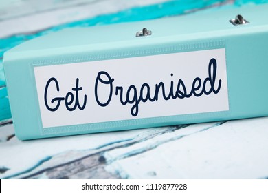 Get Organised, Organised folder on teal desk
