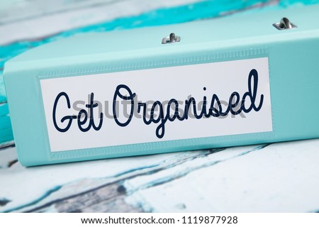 Get Organised, Organised folder on teal desk