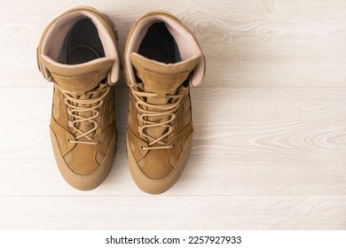Get ready for adventure with this powerful image of tactical military boots. Perfect for military, outdoor, and fashion industries, the strength and durability of the boots, ready for any challenge. - Shutterstock ID 2257927933