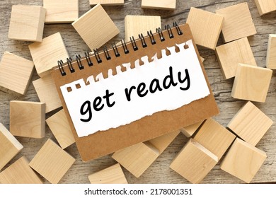 Get Ready For Megaphone On Notebook And Text On Chalkboard And Wood Blocks Background