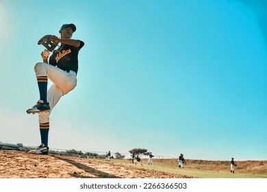 Get ready. Shot of a young baseball player pitching the ball during a game outdoors. - Powered by Shutterstock