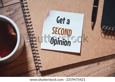 Get a Second Opinion note on desk. Top view. 