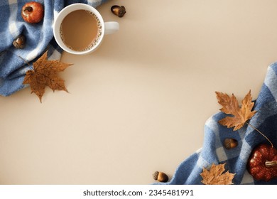 Get snug at home this fall. Top view arrangement of mug of hot chocolate, warm blanket, pumpkins, acorns, maple leaves on pastel beige background with blank space for promo or text - Powered by Shutterstock
