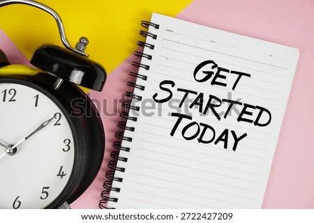 Get Started Today text written on notepad with alarm clock on pink background