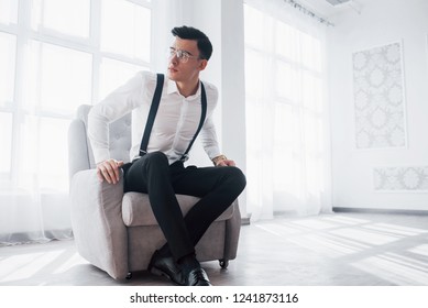 Get Up, New Deals Is Coming. Photo Of Attractive Guy In The Glasses And Stylish Wear Sitting On The Chair.