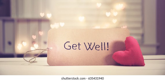 Get Well message with a red heart with heart shaped lights