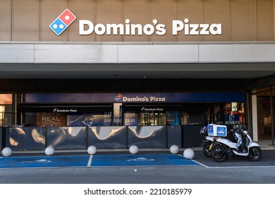 Getafe, Madrid, Spain, July 17, 2022: Facade Of Domino's Pizza Pizzeria Outside With Two Delivery Motorcycles At The Door