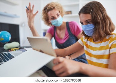 Getting Crazy With Child Home Studying Education, Homeschooling, With Private Tutor / Mother With Protective Mask In The Time Of Viruses, Flu And Seasonal Pandemic.