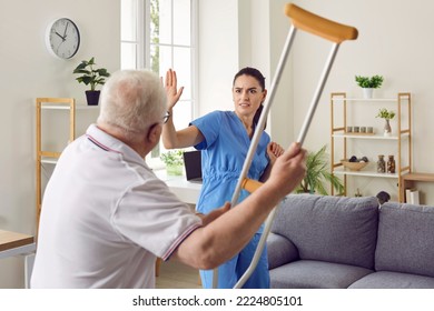 Its getting dangerous in here. Angry, aggressive, bad tempered senior patient fighting with medical worker. Old man becomes uncontrollable and threatens scared nurse or volunteer medic with crutch