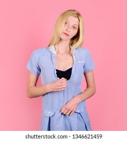 Getting Dressed. Pretty Blonde Woman Trying To Zipper On Dress. Girl In Blue Dress Holding Her Zipper. Beautiful Woman Has Problem With Zipper On Dress. Sadness Girl In Dress Trying To Fasten Zipper.