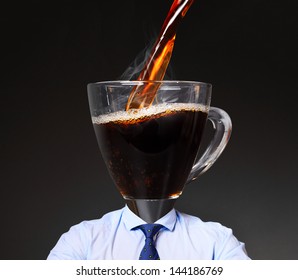 getting energy with coffee. businessman with cup instead of his head
