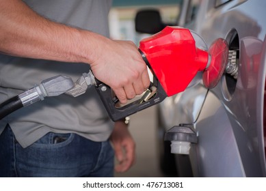 Getting Fuel At The Gas Pump, On A Sunny Day